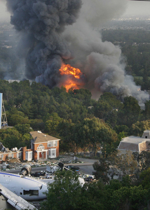 A fire rages out of control at the backlot filled with movie sets at Universal Studios in Universal City, California, 12 miles from downtown Los Angeles June 1, 2008.