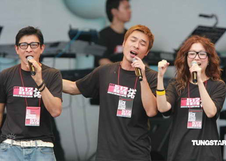 (From L to R) Andy Lau, Andy Hui and Sammi Cheung perform at a fundraising concert in Hong Kong on Sunday, June 1, 2008. The entire showbiz community of Hong Kong on Sunday staged another fund-raising concert for victims of the Sichuan earthquake.