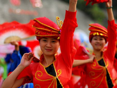 People dance at the Qu Yuan square in Zigui County, central China's Hunan Province, May 31, 2008. 
