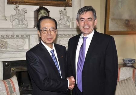 Britain's Prime Minister Gordon Brown (R) poses with his Japanese counterpart Yasuo Fukuda in 10 Downing Street London June 2, 2008.