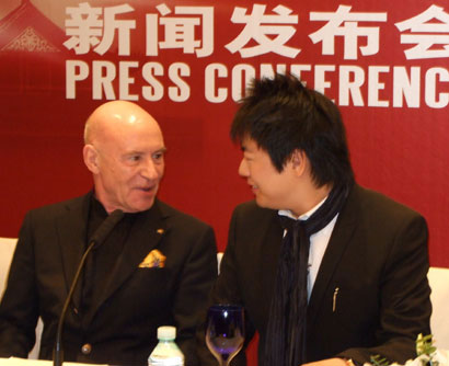 Music director of the Philadelphia Orchestra, Christoph Eschenbach (L) shares a smile with pianist Lang Lang at a press conference in Beijing on Sunday, June 1, 2008. 