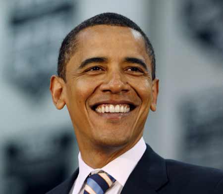 U.S. Democratic presidential candidate Senator Barack Obama (D-IL) smiles during a town hall-style meeting at Troy High School in suburban Detroit, June 2, 2008.