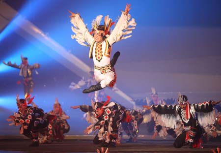 Dancers perform during the opening ceremony of the first China Xinjiang International Folk Dance Festival in Urumqi, capital of northwest China&apos;s Xinjiang Uygur Autonomous Region, on June 8, 2008. The 10-day-long festival attracts dancers and terpsichoreans from both China and countries as Russia, Egypt, Mexico, Greece, India and the Democratic People&apos;s Republic of Korea. Ten theaters in Urumqi and Changji will host 45 performances during the event. (Xinhua/Liu Yu)