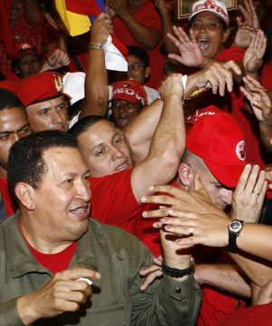 Venezuela's President Hugo Chavez greets supporters during a meeting with PSUV United Socialist Party members in Maracaibo June 7, 2008. 