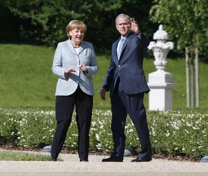 Visiting U.S. President George W. Bush agreed Wednesday with German Chancellor Angela Merkel to put diplomacy first in solving Iran's controversial nuclear program.