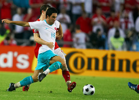 Turkey's Arda Turan (front) controls the ball during the Euro 2008 Group A football match against Switzerland in Basel, Switzerland, June 11, 2008. Turkey won 2-1.