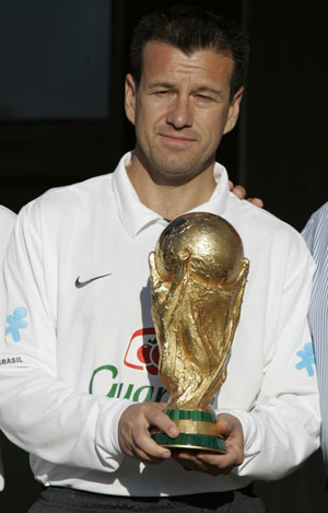 Brazil's coach Dunga holds the soccer World Cup trophy before a training session in Teresopolis June 12, 2008. Brazil will play against Paraguay and Argentina in a World Cup 2010 qualifying soccer match on June 15 and 18.