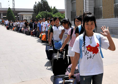 High school students from quake-affected Qingchuan of southwest China's Sichuan Province arrive in Yinchuan, capital of northwest China's Ningxia Hui Autonomous Region, on June 12, 2008. A total of 130 high shool students from Qingchuan will continue their studies at Ningxia Liupanshan Higher Middle School. Their school tuitions and daily costs are covered by the government of Ningxia Hui Autonomous Region.