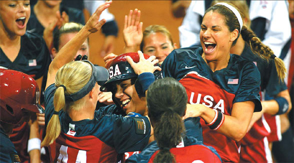 Members of the US softball team celebrate after defeating Japan in the gold medal game of the World Championships at Beijing's Fengtai Softball Field in 2006. 