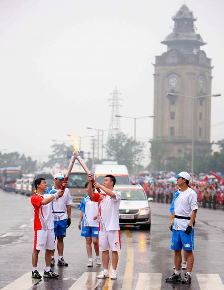 Photo: From one torchbearer to the next