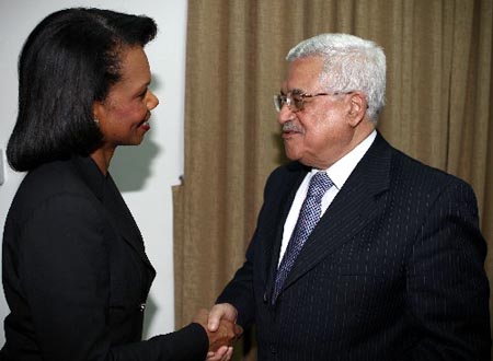 U.S. Secretary of State Condoleezza Rice shakes hands with Palestinian president Mahmud Abbas following talks in the West Bank city of Ramallah. Rice warned that Israeli settlements in the occupied Palestinian territories must not block any final Middle East peace agreement.