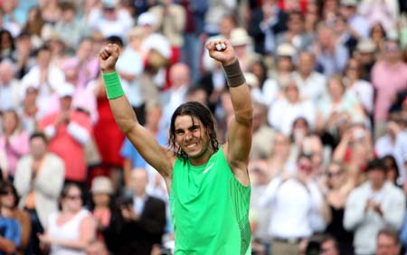 Spanish Rafael Nadal celebrates after winning the final of the Artois Championship tennis tournament against Serbian Novak Djokovic at Queen's Club in west London on June 15, 2008. Nadal won 7-6(6), 7-5.(Xinhua/Xie Xiudong) 