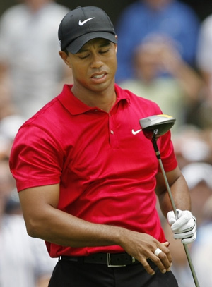 Tiger Woods reacts after hitting into the rough from the first tee during the fourth round of the U.S. Open golf championship at Torrey Pines in San Diego June 15, 2008. (Xinhua/Reuters Photo)