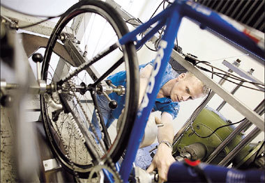 A technician examines a broken Koga Miyata bicycle at the company's factory in the Dutch northern town of Heerenveen. The Dutch cycle maker is betting that its US$1-million bike will help cyclist Theo Bos land a gold medal at the Beijing Olympics.