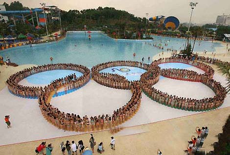 Chinese women in bikinis form the five Olympic rings at Changlong Water Park in Guangzhou, Guangdong Province, June 15, 2008. The 1,202 who participated in the event broke the Guinness World Records for the largest swimsuit photo shoot, which was previously held by 1,010 Austrians in 2007.