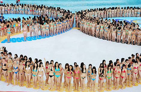 Chinese women in bikinis form the five Olympic rings at Changlong Water Park in Guangzhou, Guangdong Province, June 15, 2008. The 1,202 who participated in the event broke the Guinness World Records for the largest swimsuit photo shoot, which was previously held by 1,010 Austrians in 2007.