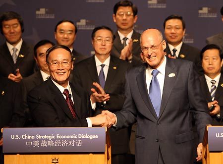 Visiting Chinese Vice Premier Wang Qishan (front L) shakes hands with US Treasury Secretary Henry Paulson (front R) at the opening ceremony of the 4th round of China-US Strategic Economic Dialogue in Annapolis, Maryland, the United States of America, June 17, 2008. China and the United States on Tuesday started here their 4th round of Strategic Economic Dialogue.