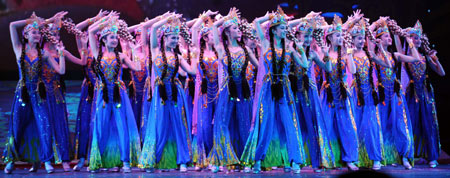 Dancers perform during the closure of the first China Xinjiang International Folk Dance Festival in Urumqi, capital of northwest China's Xinjiang Uygur Autonomous Region, June 18, 2008. The 10-day festival attracted dancers and terpsichoreans from both China and other countries including Russia, Egypt, Mexico, Greece, India and the Democratic People's Republic of Korea. 