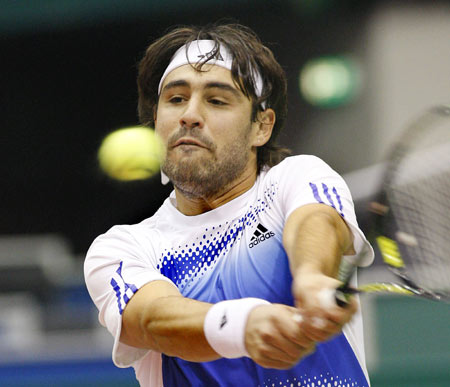 Marcos Baghdatis of Cyprus returns the ball during his match against Robin Soderling of Sweden at the ABN AMRO tennis tournament in Rotterdam February 19, 2008.