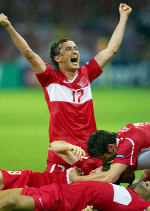 Turkish players celebrate after scoring during the Euro 2008 Group A soccer match against Czech Republic at Stade de Geneve stadium in Geneva, Switzerland, June 15, 2008. Turkey won the match 3-2. 