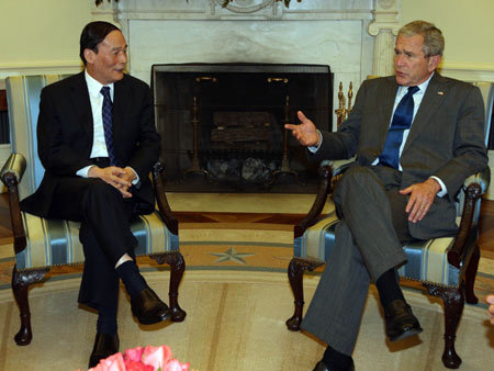 U.S. President George W. Bush (R) meets with Chinese Vice Premier Wang Qishan in the White House, June 18, 2008. Bush applauded the results of the fourth Sino-U.S. Strategic Economic Dialogue (SED) that concluded earlier in the day. 