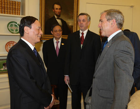 U.S. President George W. Bush (R) meets with Chinese Vice Premier Wang Qishan in the White House, June 18, 2008. Bush applauded the results of the fourth Sino-U.S. Strategic Economic Dialogue (SED) that concluded earlier in the day. 