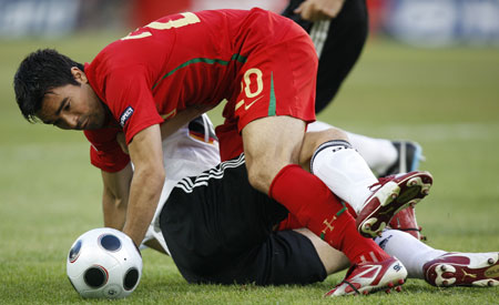 Portugal's Deco (Top) challenges against a player of Germany during the quareterfinals at the Euro 2008 Championships in Basel, Switzerland, on June 19, 2008. 