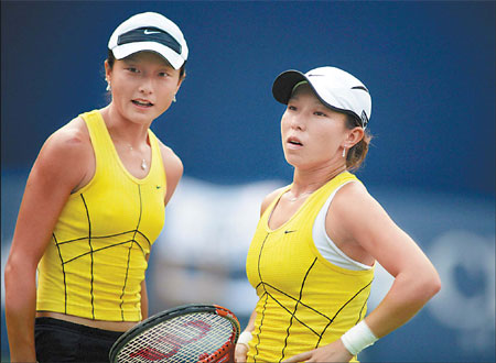 Chinese players Zheng Jie and Yan Zi (left) react to a shot during the China Open in Beijing in 2006. 