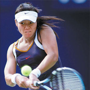 Chinese player Li Na returns a shot during the China Open in Beijing in 2006.