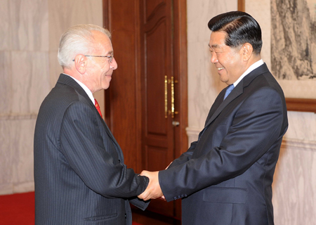 Jia Qinglin (R), chairman of the National Committee of the Chinese People's Political Consultative Conference (CPPCC), shakes hands with the visiting President of the Romanian Senate Nicolae Vacaroiu in Beijing, June 22, 2008.