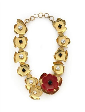 This photo provided by Christie's auction house shows an Yves Saint Laurent cut-out floral necklace from Spring/Summer 1990 with an estimated selling price of 1,000-1,500 U.S. dollars. 