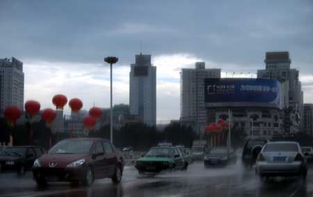 Heavy rain clouds are seen over Fuzhou, capital of southeast China's Fujian Province, June 25, 2008. Tropical storm Fengshen hit the southeast coast of China early on Wednesday, bringing heavy rain and strong winds.