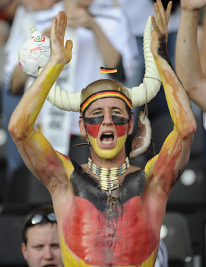 A German fan cheers before the Euro 2008 championships final between Germany and Spain in Vienna, Austria, on June 29, 2008.