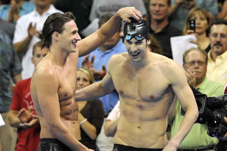 Michael Phelps (R) celebrates after he broke world record during the Men's 400m Individual Medley at the U.S. Olympic Swimming Trials in Omaha of the United States, June 29, 2008.