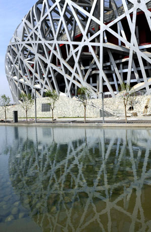 Photo taken on May 16, 2008 shows that the part of the exterior of the National Stadium is reflected in the water. The National Stadium, also known as the bird's nest will be the main track and field stadium for the 2008 Summer Olympic Games and serves as venue to the Opening and Closing ceremonies of the games. 