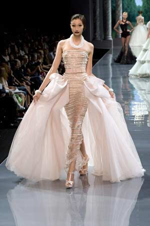 A model presents a creation as part of British designer John Galliano's Haute Couture Autumn-Winter 2008-2009 fashion show for French fashion house Dior in Paris, June 30, 2008.