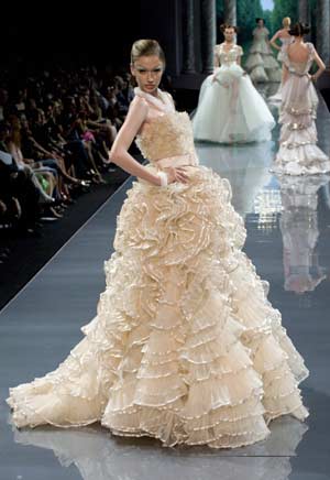 A model presents a creation as part of British designer John Galliano's Haute Couture Autumn-Winter 2008-2009 fashion show for French fashion house Dior in Paris, June 30, 2008.
