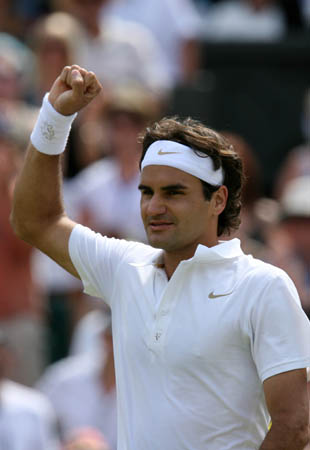 Switzerland's Roger Federer celebrates his victory over Australia's Lleyton Hewitt during the fourth round match of the men's singles at the Wimbledon Tennis Championships in London, capital of England, on June 30, 2008. Federer won 3-0 and advanced into the quarterfinal.