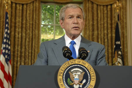 U.S. President George W. Bush speaks at the Oval Office after signing an Iraq war supplemental bill at the White House in Washington, June 30, 2008.