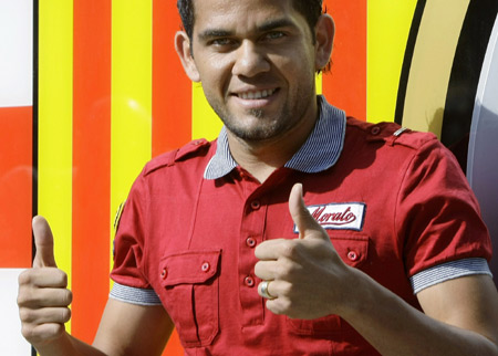 Former Sevilla's soccer player Daniel Alves of Brazil gives thumbs-up in front of the Barcelona office before his official presentation at Nou Camp stadium in Barcelona July 1, 2008. Sevilla said goodbye to Brazil full back Alves on Tuesday ahead of the 25-year-old completing his transfer to Primera Liga rivals Barcelona. (Xinhua/Reuters Photo)