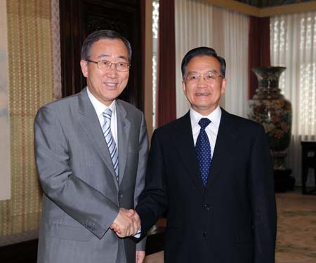 Chinese Premier Wen Jiabao (R) shakes hands with UN Secretary-General Ban Ki-moon at Zhongnanhai in Beijing, July 2, 2008.(Xinhua Photo)