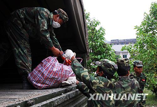 The archives and relics salvaged from the ruins of the archives building of quake-hit Beichuan County were put on a truck in southwest China&apos;s Sichuan Province on Friday, July 4, 2008. [Photo: Xinhua] 