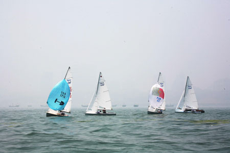 Chinese and foreign athletes practise for the Olympic sailing competition in Qingdao, Shandong Province July 6, 2008. With algae almost cleared, Olympic sailors begin to practise normally.