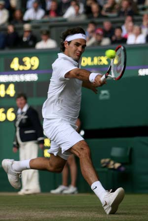 Roger Federer of Switzerland returns a shot during the men's singles final match against Spain's Rafael Nadal at the Wimbledon tennis tournament in London, capital of Britain, on July 6, 2008. Spain's Rafael Nadal won the match 6-4, 6-4, 6-7, 6-7, 9-7 and claimed the title.