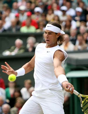 Spain's Rafael Nadal returns a shot during the men's singles final match against Roger Federer of Switzerland at the Wimbledon tennis tournament in London, capital of Britain, on July 6, 2008.