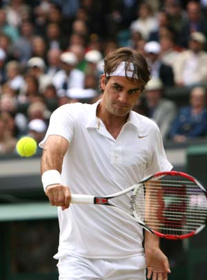 Roger Federer of Switzerland returns a shot during the men's singles final match against Spain's Rafael Nadal at the Wimbledon tennis tournament in London, capital of Britain, on July 6, 2008.
