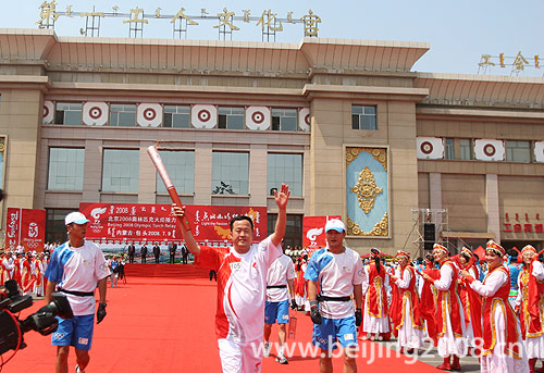 Hu Gangjun starts the Olympic torch relay in Baotou, Inner Mongolia Autonomous Region July 9. 