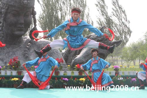 Traditional ribbon dance is performed to welcome the Olympic torch in Chifeng city, Inner Mongolia Autonomous Region, on July 10.