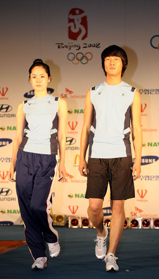 Models wear sporty outfits of the Korean Delegation to the Beijing Olympic Games, July 9, 2008. 