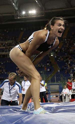 Yelena Isinbaeva of Russia reacts after setting a new world record in the women's pole vault during the Golden Gala IAAF Golden League at the Olympic stadium in Rome July 11, 2008.